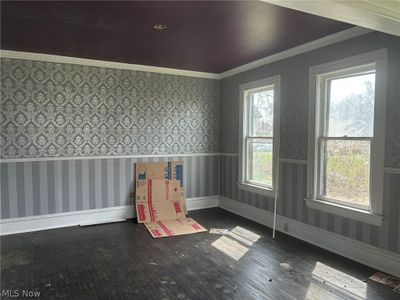 Spare room featuring crown molding and dark hardwood / wood-style floors | Image 3