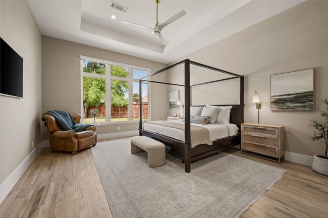 Primary Bedroom with Sitting Area Overlooking the Backyard. | Image 20