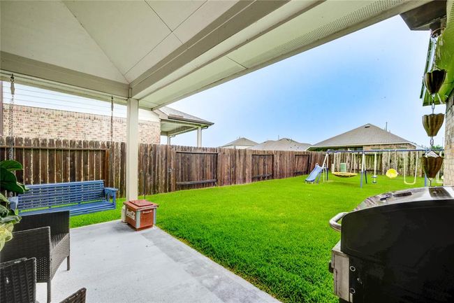 Peaceful covered back patio | Image 35