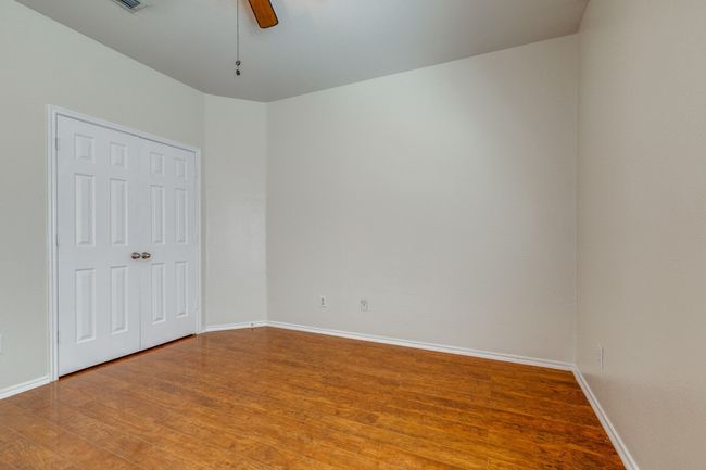 Unfurnished room featuring light wood-style flooring, ceiling fan, and baseboards | Image 20