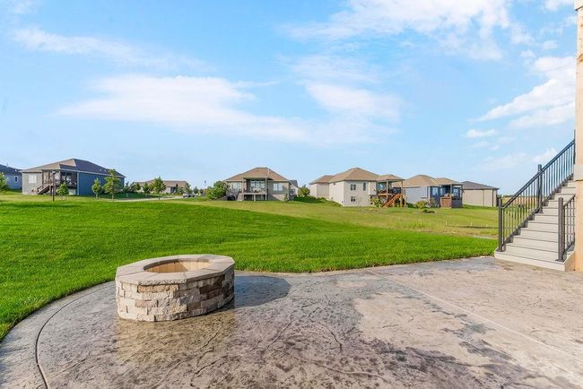 Option to do a patio to match this if preferred with stamped concrete and firepit. Photos of previous model home. Not actual listing. Features and sizes may vary. Contact agent for details & showings! | Image 27