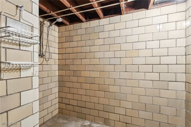 Full bath with concrete flooring and tiled shower | Image 25
