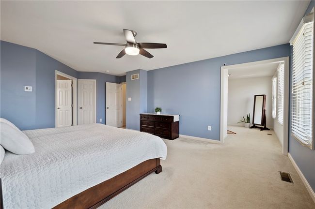 The primary bedroom includes a separate sitting room and a large walk-in closet. | Image 15