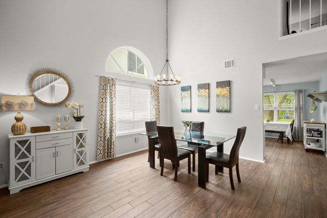 This formal dining area is ideal for hosting dinner parties, offering plenty of space to gather around the table and create lasting memories with friends and family | Image 10