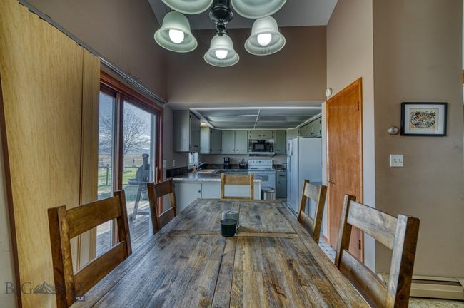 Dining area, looking into kitchen | Image 10