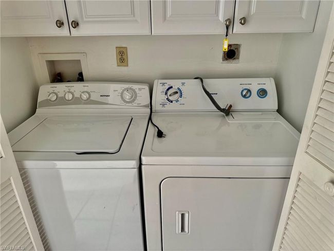 Laundry room with cabinet space and washing machine and dryer | Image 25