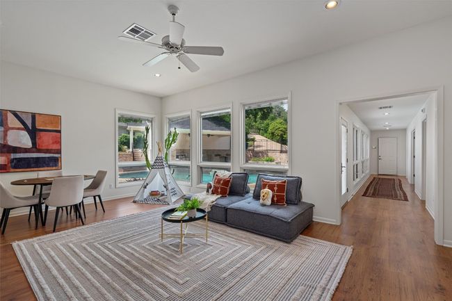 This large living area has an amazing view of the pool | Image 21