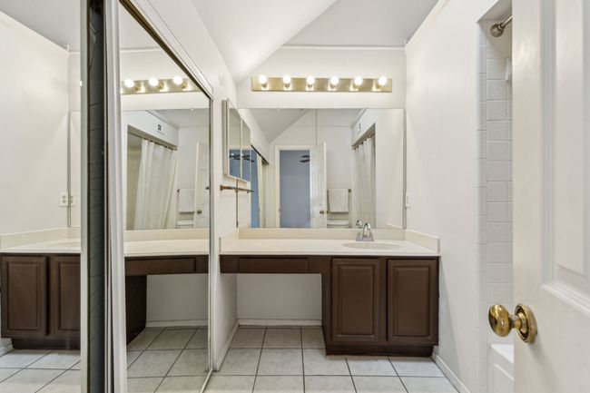 Full bathroom with vanity and lofted ceiling | Image 27