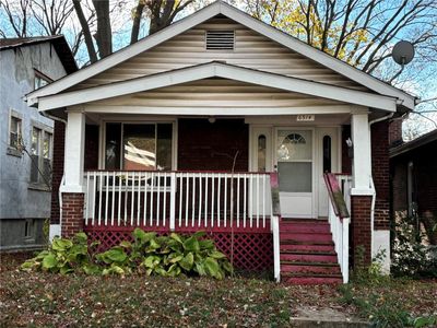 View of front of home with covered porch | Image 1