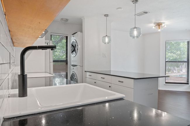 The kitchen overlooks the dining area making it easy to serve up home cooked meals and stay connected. | Image 8