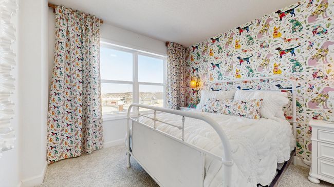 (Photo of a model home, actual features may vary) Each of the home's secondary bedrooms on the upper level come perfectly sized and feature a spacious closet. | Image 13