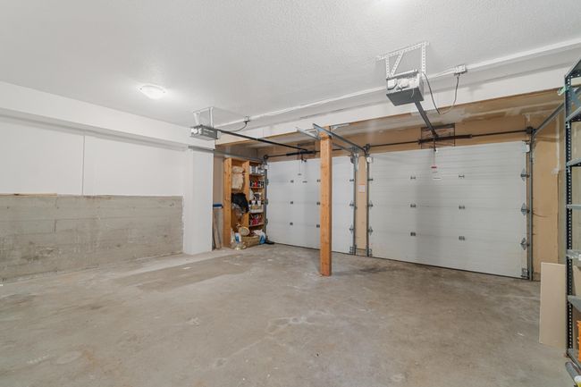 Garage featuring a garage door opener | Image 34