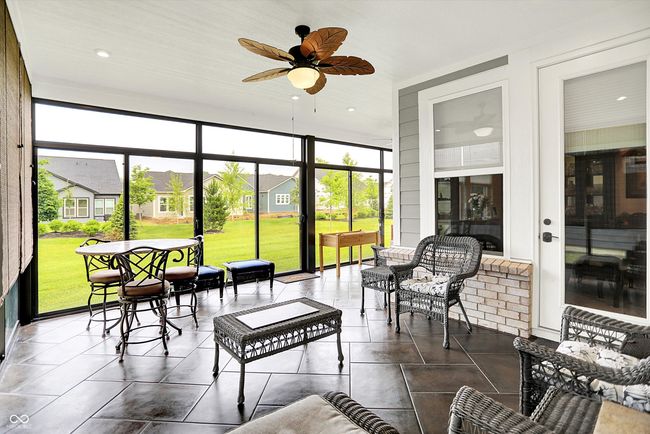 Fabulous added sunroom featuring ceiling fans and all encased glass doors. | Image 8