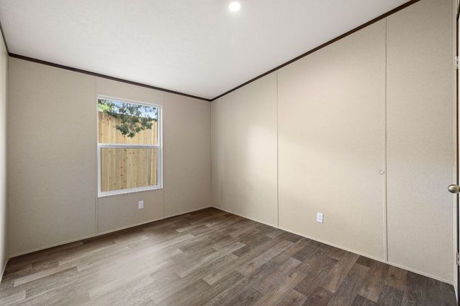 Spare room with recessed lighting, wood finished floors, and crown molding | Image 28