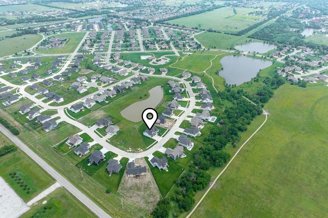 Aerial overview of property's location with a nearby body of water | Image 36