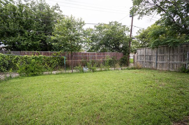 View of fenced backyard | Image 20
