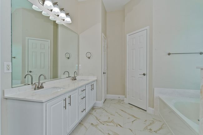 Primary Bath Features New Shower Enclosure, Duel Sinks, Granite Countertops And A Garden Tub. | Image 23