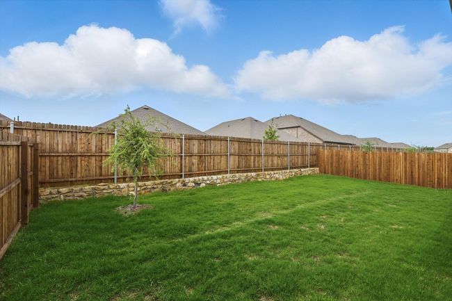 View of fenced backyard | Image 31
