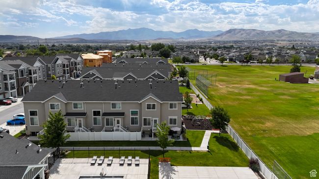 Aerial perspective of suburban area featuring a mountain backdrop | Image 39