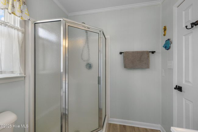 full bath with shower accessible from bedroom and hall | Image 26
