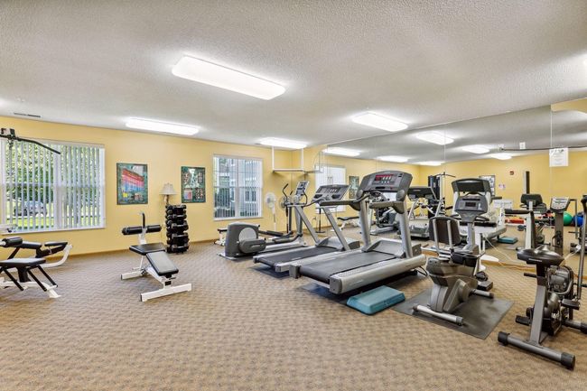 A fully stocked gym, open 24 hours a day, offering a complete range of equipment to support your health and fitness goals at any time. | Image 28