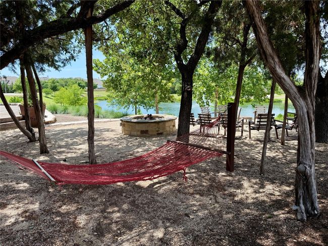 Relax in the shade overlooking the pond. | Image 35