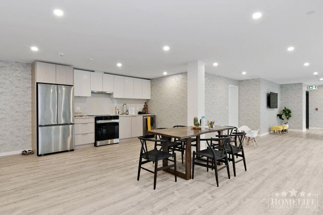 Dining room featuring wallpapered walls, light wood-style flooring, baseboards, and recessed lighting | Image 27