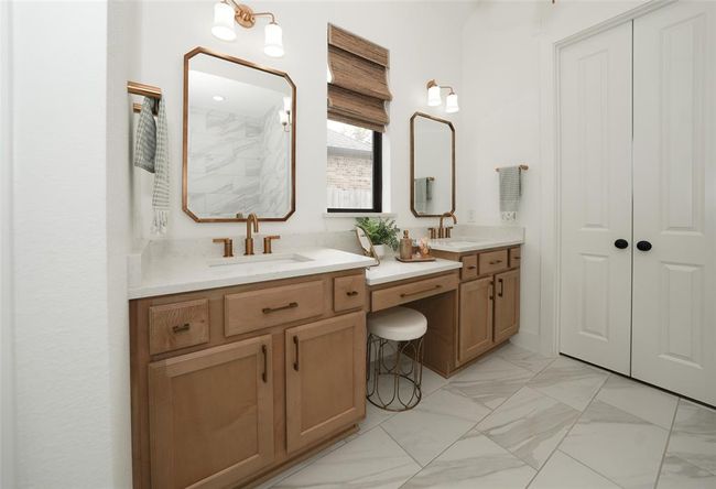 Elegant gold Moen hardware adds warmth and sophistication to the suite. | Image 22