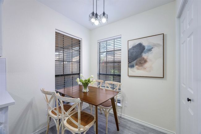 Dining room featuring baseboards and wood finished floors | Image 12