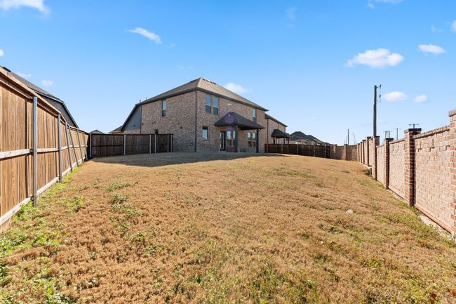 View of yard featuring a fenced backyard | Image 22