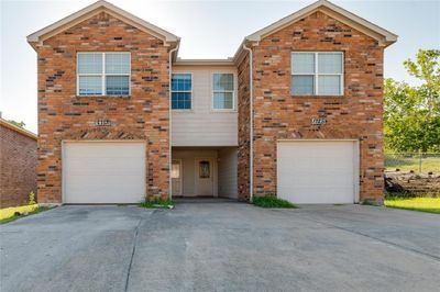 View of front of house featuring a garage | Image 1