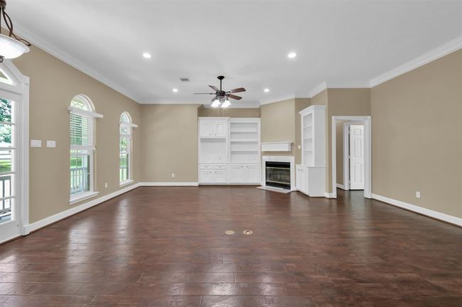 Living Room showing the built ins on both sides of the Fireplace. | Image 10
