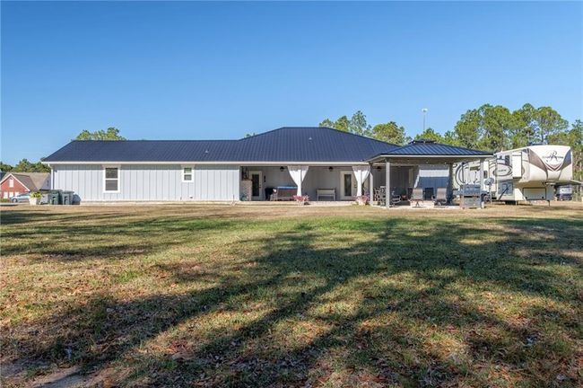 Back of property featuring a patio area and a lawn | Image 32