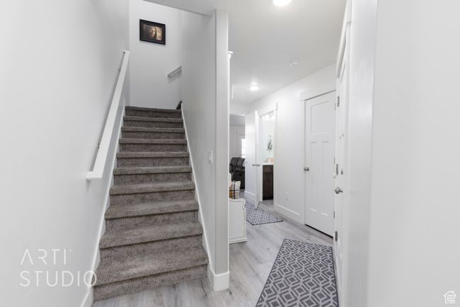 Stairs featuring baseboards and wood finished floors | Image 7