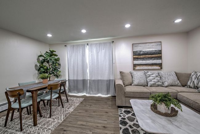 Living room featuring dark wood finished floors and recessed lighting | Image 10