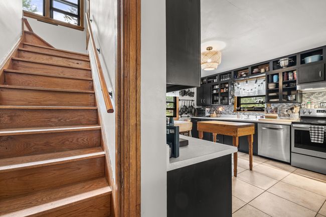View from living room up the stair or back to the kitchen | Image 9
