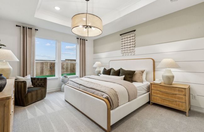 Elegant owner's suite with large windows *Photos of furnished model. Not actual home. Representative of floor plan. Some options and features may vary | Image 13