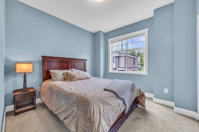 Carpeted bedroom featuring baseboards | Image 20