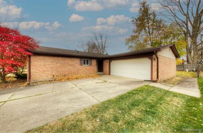 1697 Ranier Boulevard, Home with 3 bedrooms, 2 bathrooms and null parking in Canton Twp MI | Image 1