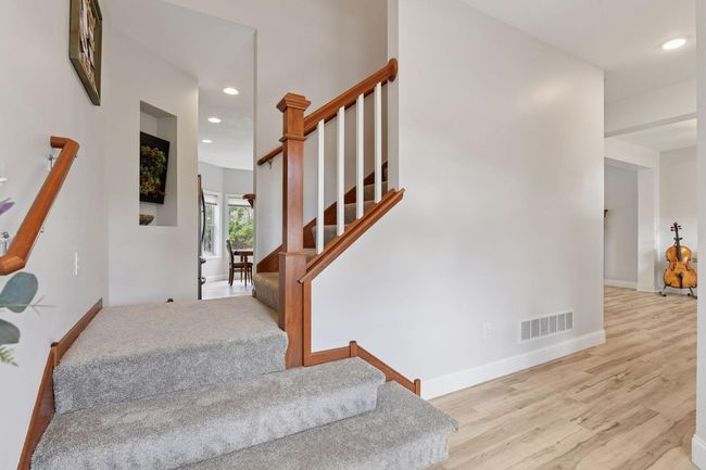 Stairwell leading upstairs or to the kitchen. | Image 4