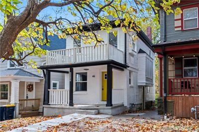 View of front of home featuring a balcony and a porch | Image 1