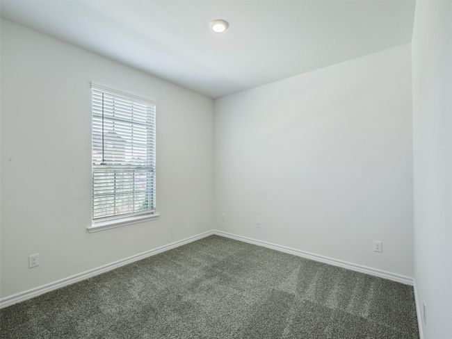Unfurnished room with dark carpet and baseboards | Image 20