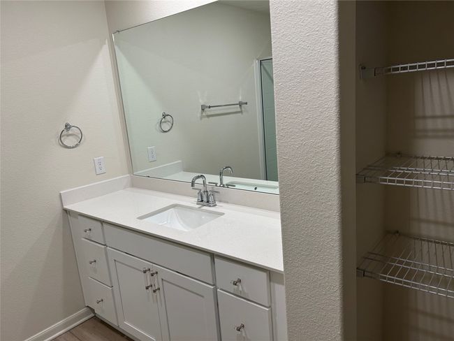 Bathroom with vanity and wood finished floors | Image 9