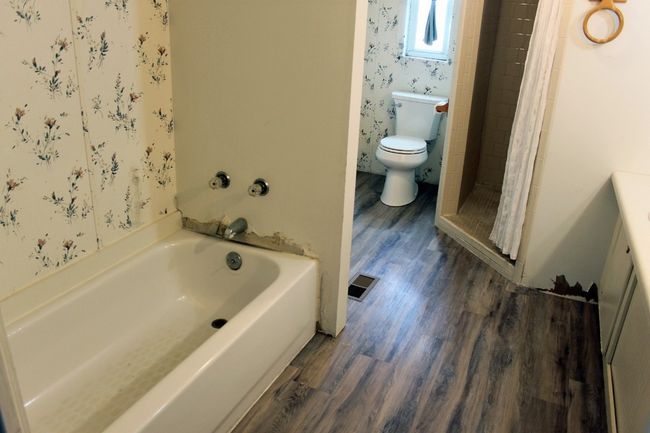 Full bathroom with toilet, wood finished floors, a bathtub, and a shower stall | Image 17