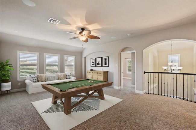 Playroom with a chandelier, carpet, and plenty of natural light | Image 23