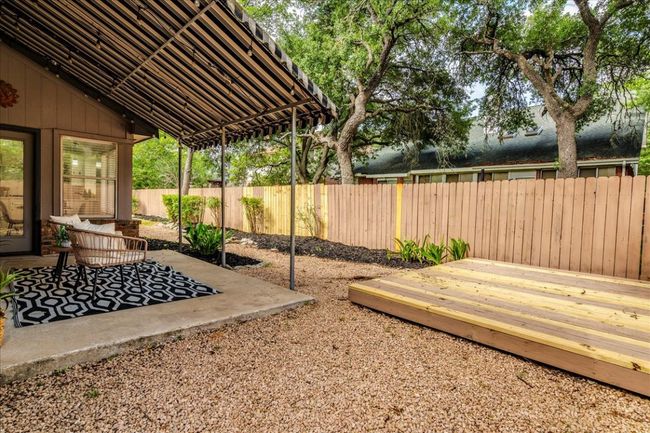 Fenced backyard featuring a patio area and a deck | Image 32