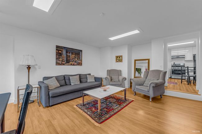 Living area with light wood finished floors and baseboards | Image 29