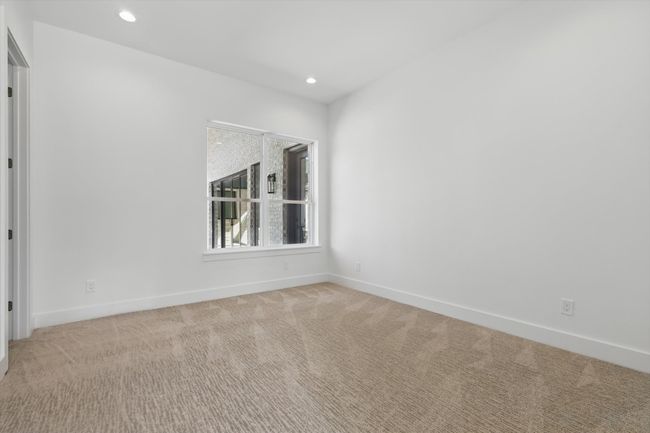 Spare room featuring light carpet, baseboards, and recessed lighting | Image 27