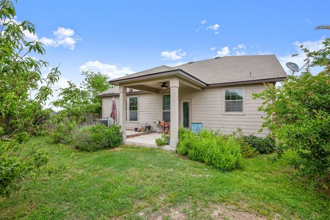 Back of house featuring a patio, a ceiling fan, fence, and a yard | Image 30