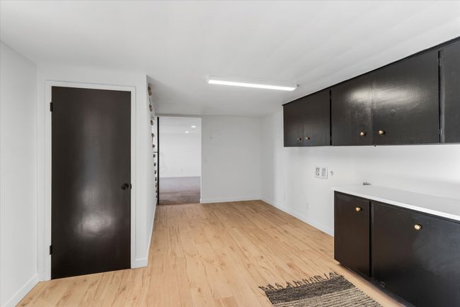 Kitchen with light hardwood / wood-style flooring | Image 30